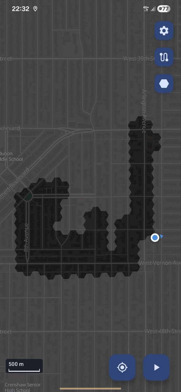 Grey hexagons cleared into an L-shape along a walked route